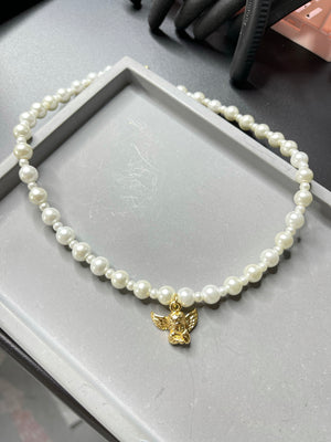 
                  
                    The Angel Pearl Necklace
                  
                
